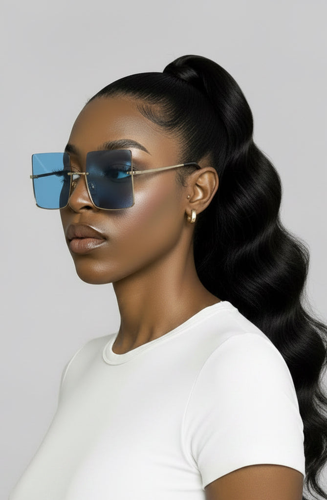 Woman wearing blue sunglasses with a white background