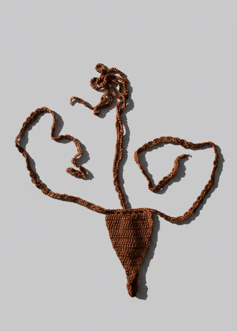 Brown crocheted thong bikini on a light gray background