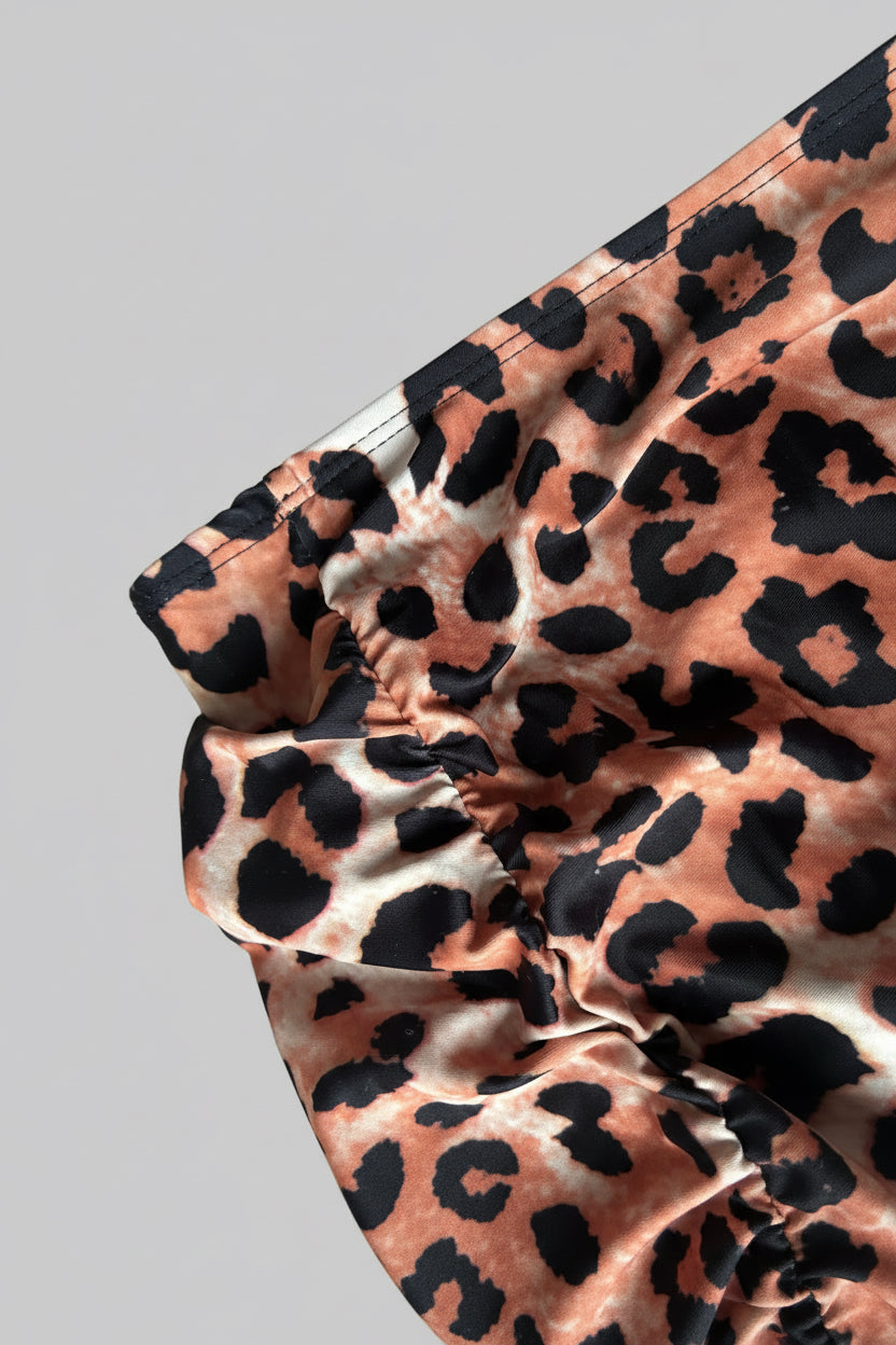 Close-up of a leopard print fabric with ruched detailing