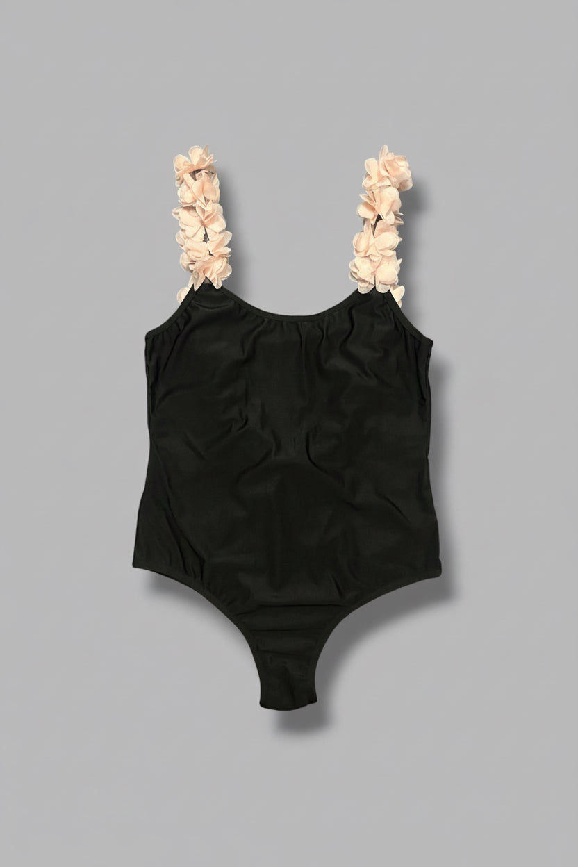 front shot of the tulle flowers on the backless black Wifey swimsuit by eau archives