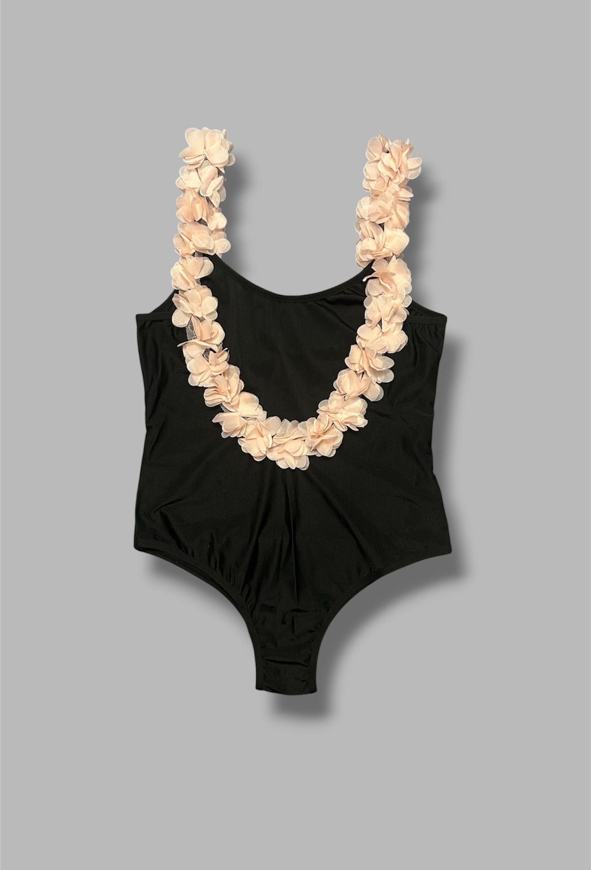 Back shot of the tulle flowers on the backless black Wifey swimsuit by eau archives