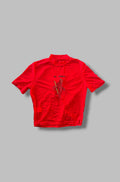 Red mesh cropped t-shirt with a graphic design on a gray background