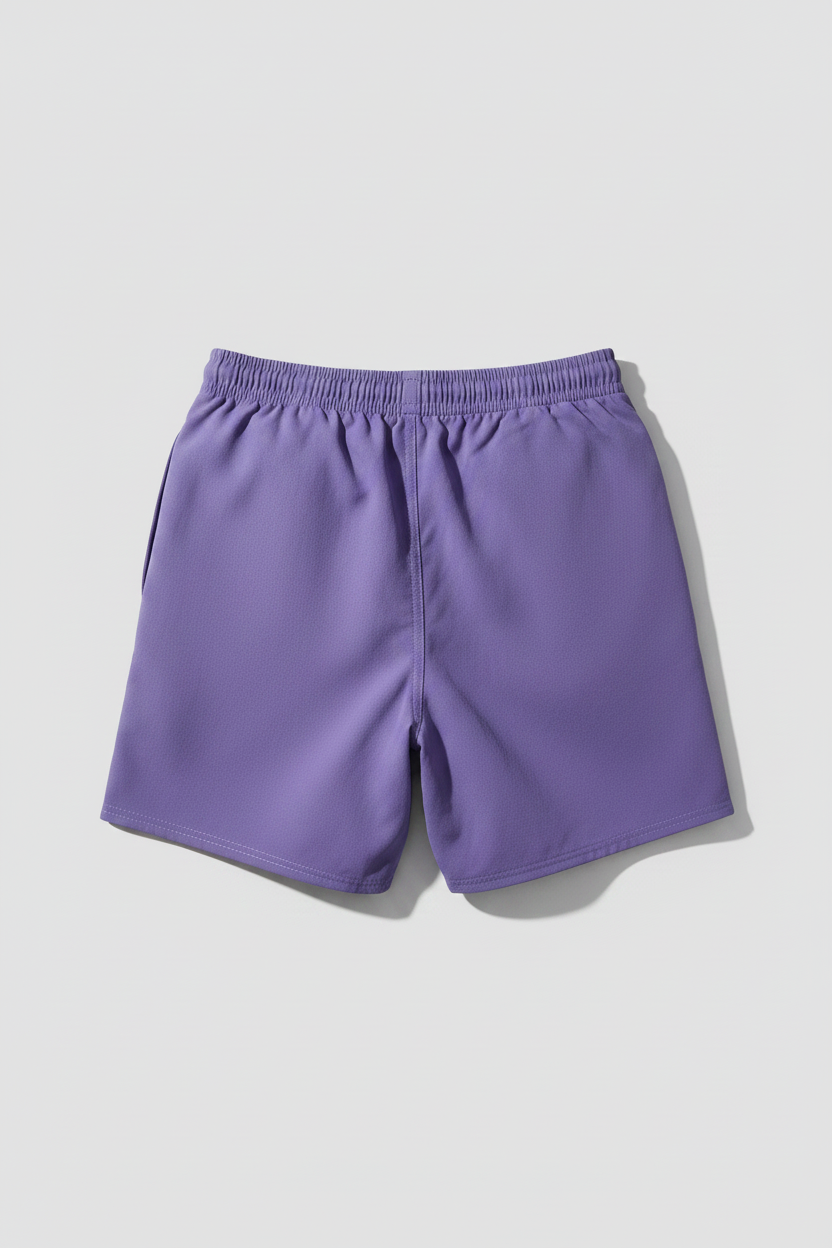 Back view of purple swim trunks with blue stitching on a gray background 